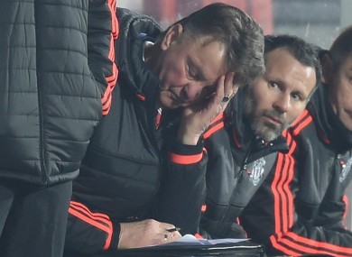Louis van Gaal with his head in his hands.
