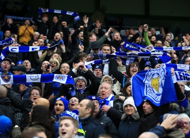 Leicester City fans celebrate during the Barclays Premier League match at the Etihad Stadium.