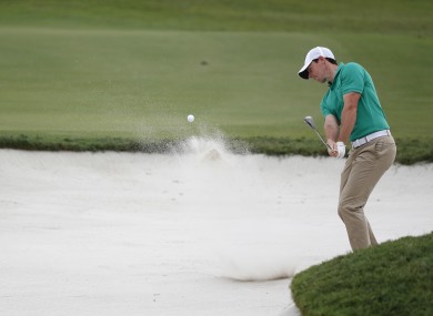 Rory McIlroy hits from the sand on the 12th hole during the third round of the Cadillac Championship golf tournament.