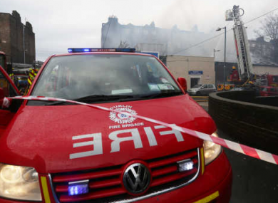 Firemen from Dublin fire brigade fight a fire in a property on Fitzgibbon Lane in Dublin.