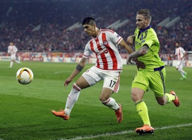 Olympiakos' Alan Pulido, left, fights for the ball with Anderlecht's Alexander Buttner during a Europa League match in February.