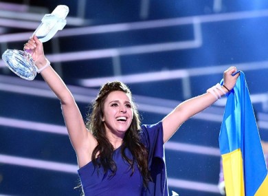 Ukraine's Jamala celebrates with the trophy after winning the Eurovision Song Contest final with the song 1944 in Stockholm, Sweden.