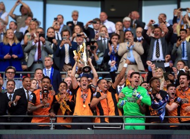 Hull captain Michael Dawson lifts the trophy.