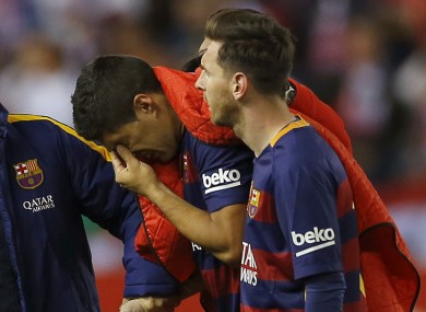 Luis Suarez limps off.