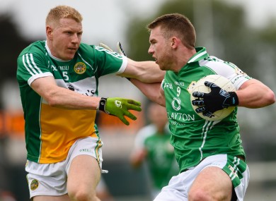 Offaly's Niall Darby and London's Liam Gavaghan in opposition today.