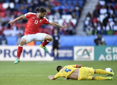 Romania's Gabriel Torje tackles Switzerland's Ricardo Rodriguez.