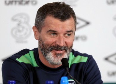 Keane shares a joke with the media.