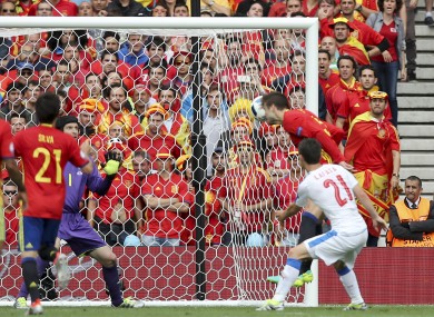 Gerard Pique heads home Andres Iniesta's cross.