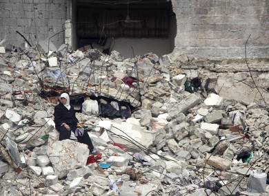 2013 file photo of ruins following an airstrike in Aleppo.
