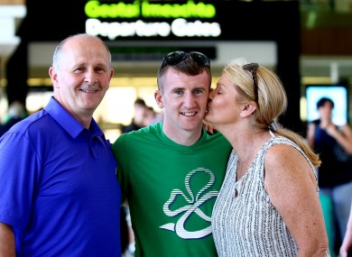 Barnes with his parents Paddy and Ellen at Dublin Airport before departing for Brazil.