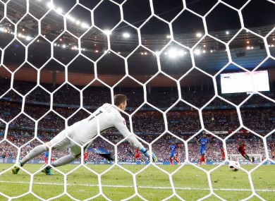 Portugal's Eder, second from the right, scores the winning goal past French goalkeeper Hugo Lloris.