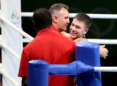 Billy Walsh celebrates Team USA's first boxing medal of the Rio Olympics with his fighter Nico Hernandez.