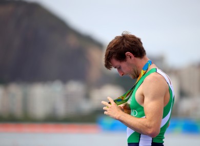 Paul O'Donovan gets a closer look at his Olympic medal.