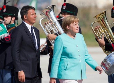 Italian Premier Matteo Renzi and German Chancellor Angela Merkel at Naples' Capodichino international airport today.