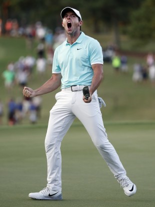 McIlroy: took four playoff holes to separate him and Moore.