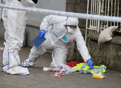 Blood stained items on the pavement outside the house.