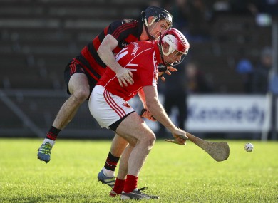 Ballygunner's Barry Coughlan and Passage's Eoin Kelly battle for possession.