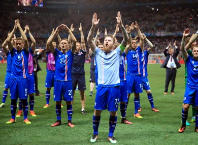Iceland captain Aron Gunnarsson and his team-mates celebrate after defeating England in France back in June.