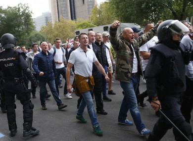 Legia's fans are escorted by riot police on their way to the Santiago Bernabeu.