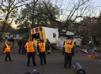 In this photo provided by the Chattanooga Fire Department via Chattanooga Times Free Press, Chattanooga Fire Department personnel work the scene.