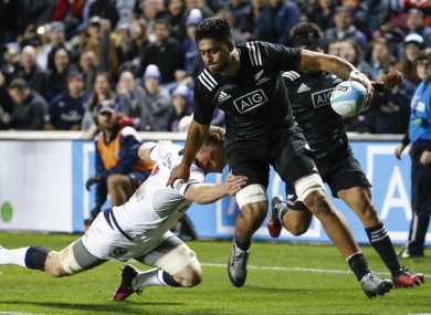 Akira Ioane of the Maori All Blacks scores despite the best efforts of USA's Tony Lamborn.