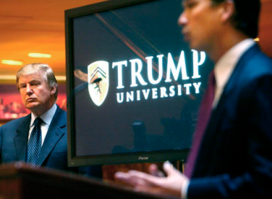 In this May, 2005 file photo, then real estate mogul and reality TV star Donald Trump, left, listens as Michael Sexton introduces him at a news conference in New York where he announced the establishment of Trump University.