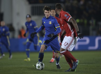 Rostov's Dmitri Poloz, left, controls a ball next to Bayern's Jerome Boateng.