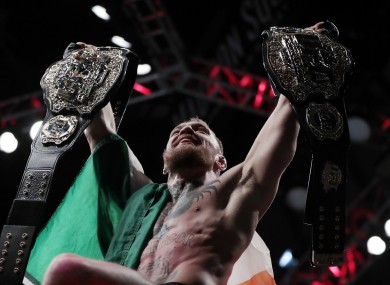 McGregor: added lightweight title to his collection on a historic night.
