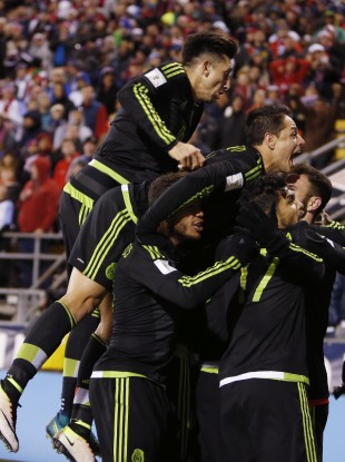 Mexico players celebrate their winning goal against the United States.