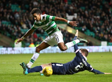 Celtic's Scott Sinclair is tackled by Ross County's Marcus Fraser.