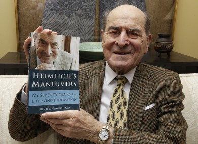 Dr. Henry Heimlich holds his memoirs prior to being interviewed at his home in Cincinnati in 2014.