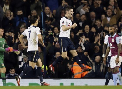Tottenham's Ben Davies, centre, celebrates after scoring a goal.