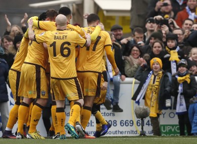 Sutton's players celebrate the goal of Jamie Collins.