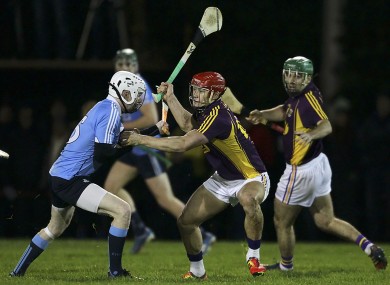 Wexfor's Lee Chin (right) and Dublin's Fiontán Mac Gib battle for possession.