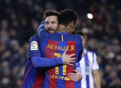 Lionel Messi, left, celebrates with his team mate Neymar after scoring a penalty.