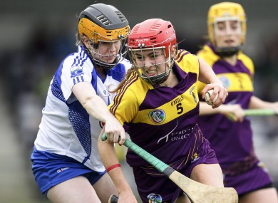 Wexford's Sarah O'Connor is tackled by Waterford's Catriona McGlone.
