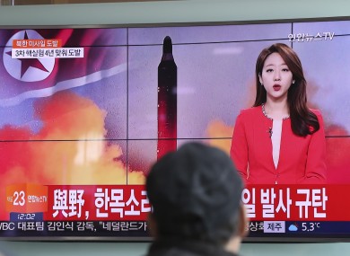 A man watches a TV news program reporting about North Korea's missile at the Seoul Train Station, South Korea.