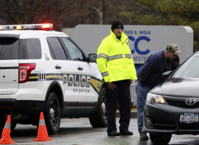 Police officers investigate a bomb threat outside the Louis S. Wolk Jewish Community Center of Greater Rochester in Brighton.