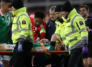 Republic of Ireland's Seamus Coleman is stretchered off the pitch.