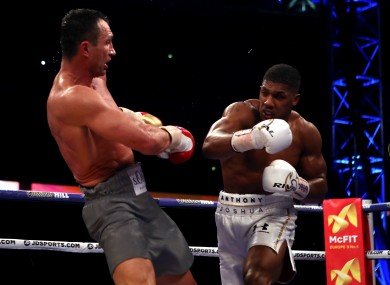 Anthony Joshua (right) competing against Wladimir Klitschko during their IBF, WBA and IBO Heavyweight World Title bout at Wembley Stadium.