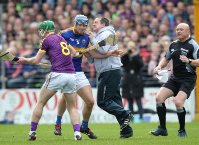 Davy Fitzgerald and Jason Forde clash in the hurling league semi-final.