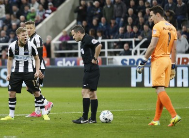 Matt Ritchie voices his disgust with referee Keith Stroud.