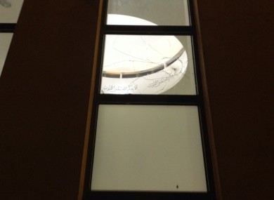 The smashed window at the mosque.