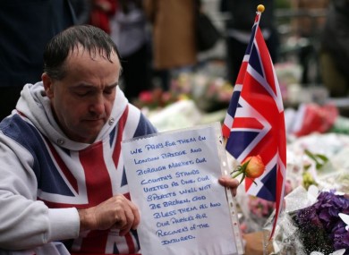 People at a vigil in Potters Fields Park, central London