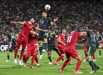 Serbia's Luka Milivojevic and Wales' Sam Vokes.