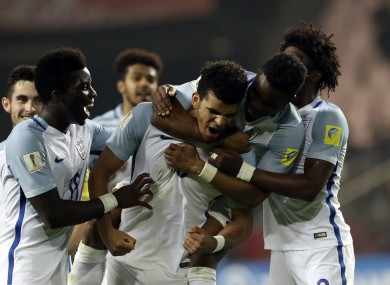 The Egnland players celebrate with goalscorer Solanke.