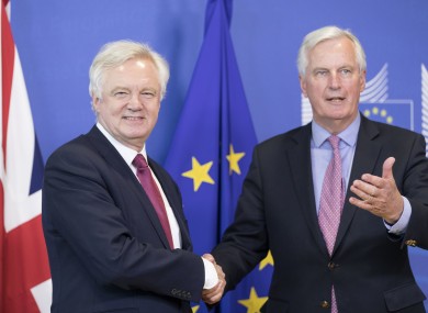 The UK's chief negotiator David Davis shakes hands with his EU counterpart Michel Barnier today.