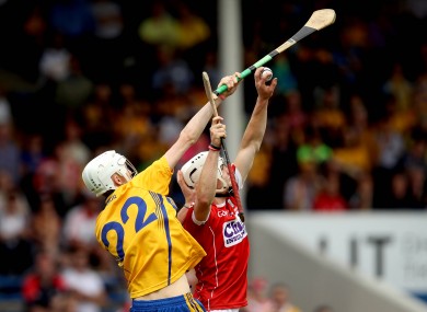Cork full-back Sean O'Leary Hayes catches the ball over Clare's Colin Haugh.
