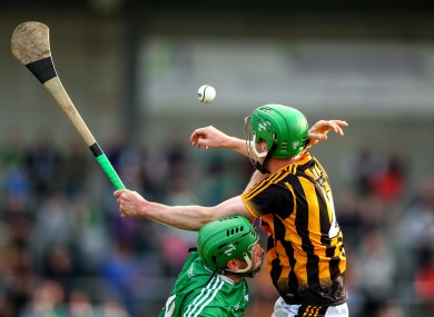 Joey Holden and Shane Dowling battle for possession.