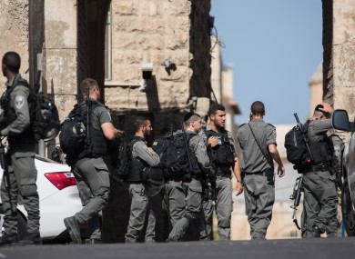 Israeli police guard the Lions Gate of Jerusalem's Old City near the site of the attack.